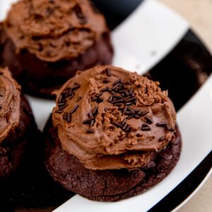 Chocolate Buttercream, Rich chocolate cookie topped in soft chocolate buttercream and chocolate sprinkles.