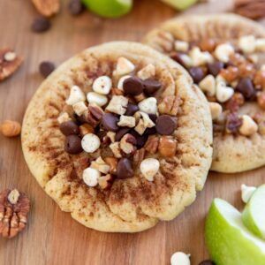 SnickerAppleChip, freshly diced apple, caramel, pecans, white and chocolate chips, all on top of our delicious Snickerdoodle base; a cookie you will not find anywhere else